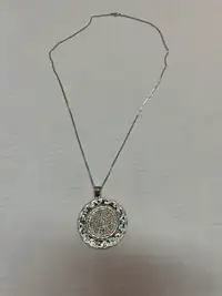 Silver Aztec calendar pendant and chain.