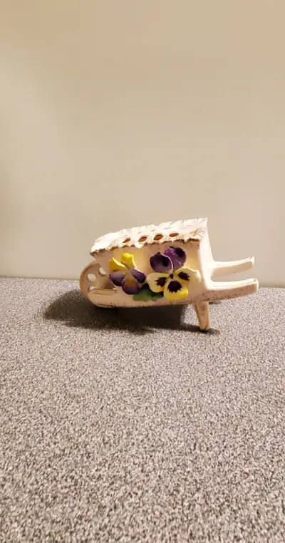 7 inches long x 3.5 inches tall x 2.75 wide, with a removable frog top, for small flowers. Very unus...