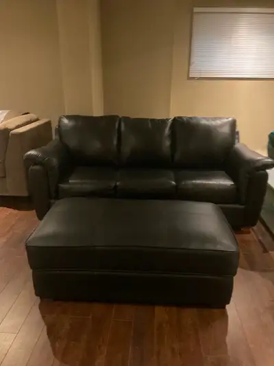 Black leather couch and Ottoman, View more