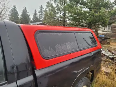 Red conopy off of a chevy truck no glass in the front back opens and closes no keys