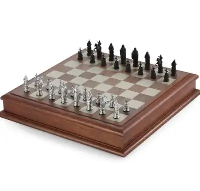 Enjoy strategic gameplay with this elegant antique pewter & wooden chess set circa 1970. Featuring s...