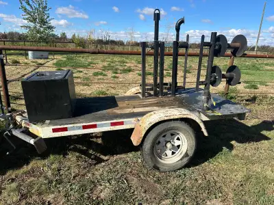 Small yard trailer used as welding trailer has reels and tank stands comes with welding prep table o...