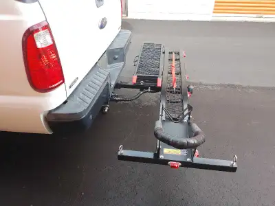 Motorbike carrier . Lights , signals , ramp and front wheel lock . Used once for 10 min . Need to mo...