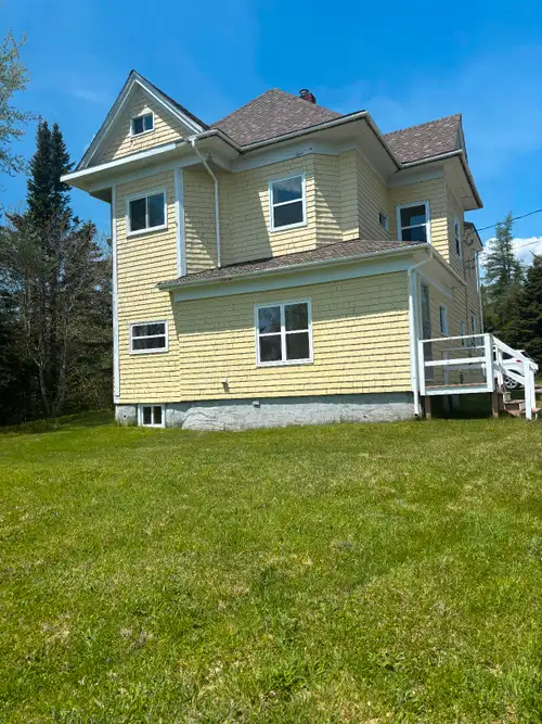 Over a century old 3 bedroom captain house with a window bench with ocean view on 2.7 acres with pav...
