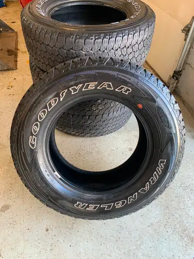 Good set of 4 good year wrangler LT275/65/R18 truck tires Around 50%+ Tread remaining, good for a fe...