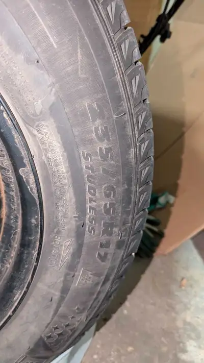 Michelin Latitude X-Ice winter tires with decent tread left. 235/65/R17 on black metal rims