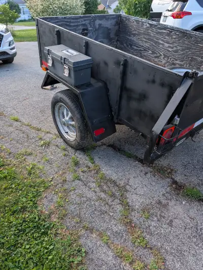 This Bushwacker utility trailer is a reliable, pre-owned workhorse ready for your next project or ha...
