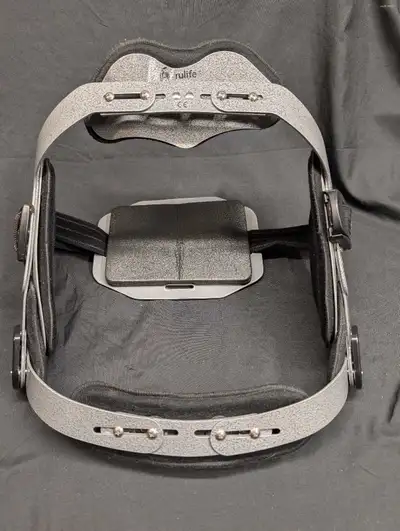 Up for sale is a used back brace True life brand. The front metal plate is slightly damaged so price...