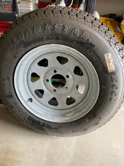 Brand New Load Star Tire on New Rim never used. Boat Trailer 205/75 D14