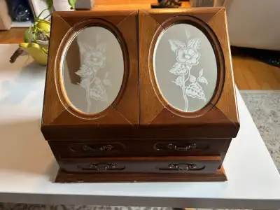 Vintage jewelry box with wind up music box feature. Wind it up and pull out the bottom drawer to pla...