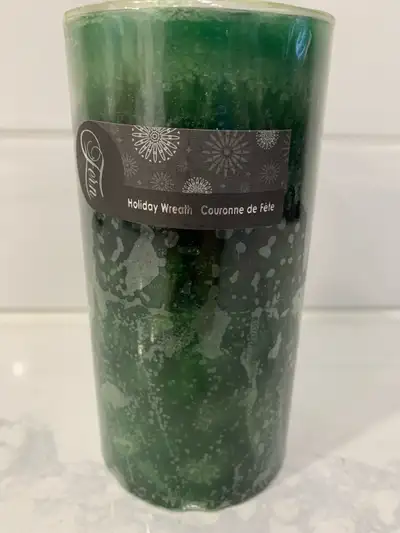 Selling a Christmas green candle - Holiday wreath - new - $10.00 New Asking $10.00 Thank you for sto...