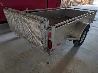 Enbeck aluminum utility trailer with folding rear ramp. Purchased new in 2022. Been a great trailer,...