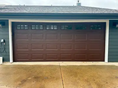 16' x 7' metal insulated garage door panels. Brown weather strip trim. No hardware. Zero wrong with...