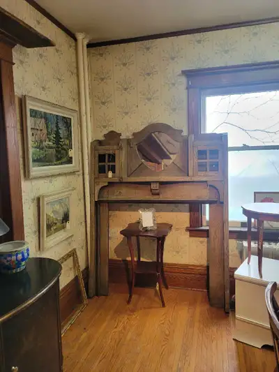 This is an antique oak wood fireplace mantel, perfect for adding a touch of vintage charm to your ho...