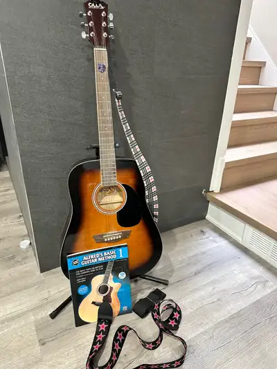 Beginner acoustic guitar with book, View more