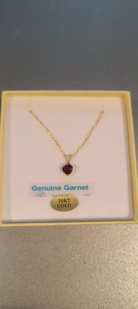 10 kt gold pendant with genuine garnet and sterling silver chain