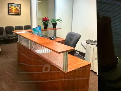 This professional office space in Toronto features a clean, functional layout with a private work ar...