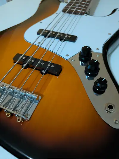 Selling a basically brand new Fender Squier Jazz Bass. 4-Strings. Maple Fingerboard. Sunburst colour...