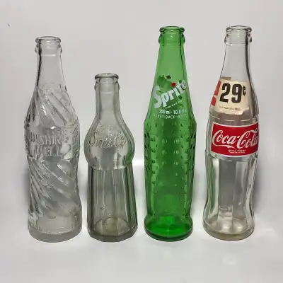 Four antique and vintage soda pop bottles, Wishing Well VG "small chip on foot rim & some rubbing",...