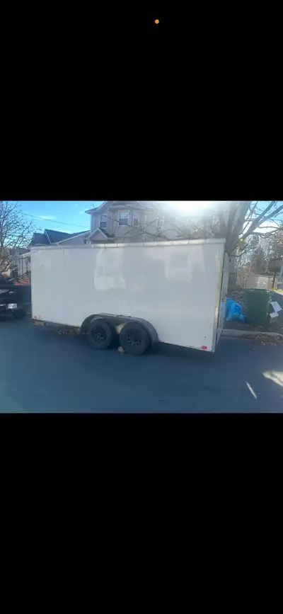Priced to sell - 2018 16 feet Spacious white enclosed cargo trailer. Has dual axles. Has rear ramp d...