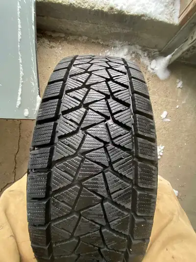 Bridgestone Blizzak 225/65R17 Used one season on Jeep Cherokee, low KM. 4x tires, mounted on rims 4x...