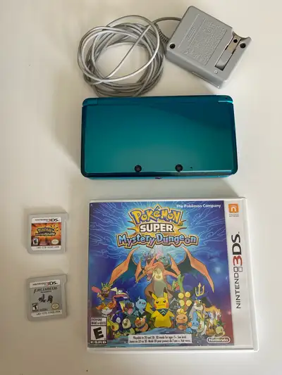 Aqua Blue 3DS, charger and original stylus included. 3 games: Pokemon Super Mystery Dungeon, Pokemon...