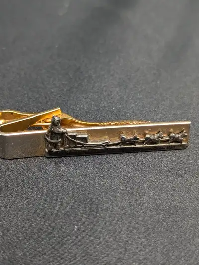 Sled is in black metal Fine detail on dogs and sled No markings on back 1 3/4 inch or 4.5 cm in leng...