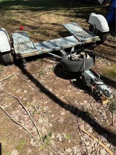 Car dolly nice shape, good tires. Has breaks and straps. Make: Forrest River Possible trade for snow...