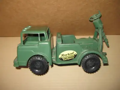 FOR SALE Plastic drill rig truck made in USA measures 10in. long 5in. wide.
