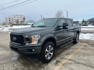 2020 Ford F-150 Super Crew STX 2.7L EcoBoost 4x4 Has leveling kit, tow mirrors, and tires that are 8...