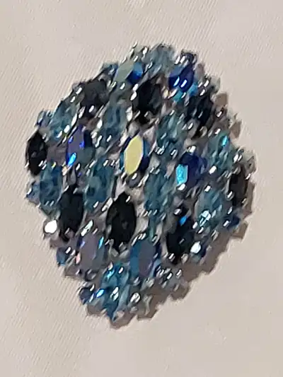 Unique, elegant set of sparkling blue rhinestones. Necklace - $600.00 Broach - $250.00 Earrings - 15...