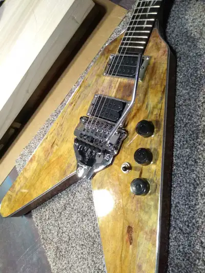 Hi my name is Todd. Thanks for looking. d:0) I built this one last year. The Dimarzios sound great,...