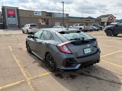 Selling my 2020 Honda Civic Sport Touring Hatchback (top trim) with a 6-speed manual transmission. T...