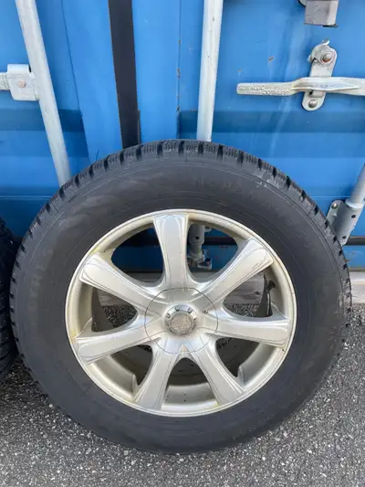Four (4) 235/60 R17 Nokian winter tires on rims. Tread depth is approximately 60% - 70%