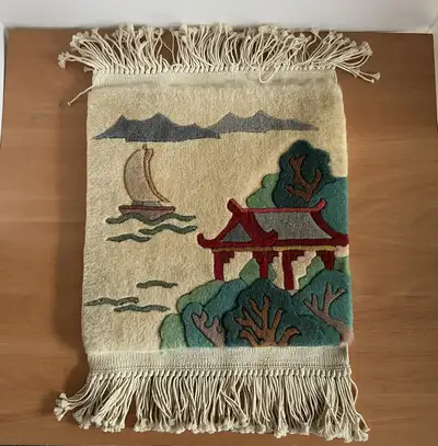 Decorative wall hanging featuring an Asian-themed landscape with a pagoda, boat, and mountains, perf...