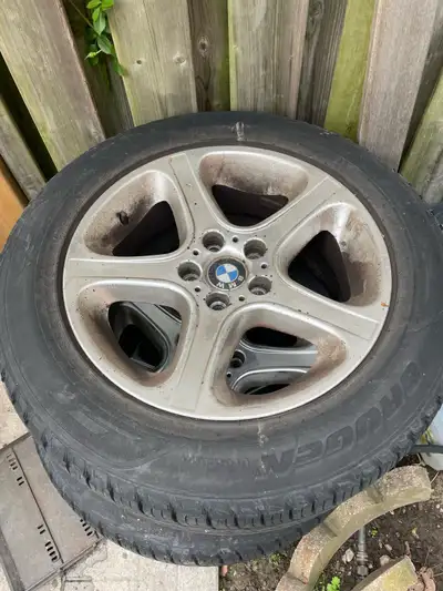 These are a set of used BMW rims designed for the X5 model, sized at 255/55R18 109V, paired with Kum...