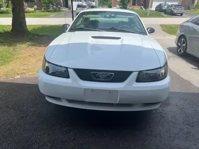 2001 Ford Mustang. White exterior and grey interior, ready for its next adventure. The car has been...
