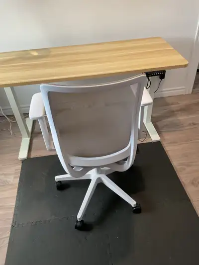 Electric height adjustable table with office chair. $500 506-253-2259 moving out of province.