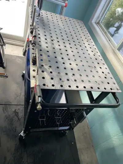 40” x 24” top, 3’ height. Assortment off clamps and mounted on casters. $180 cash only please. Price...