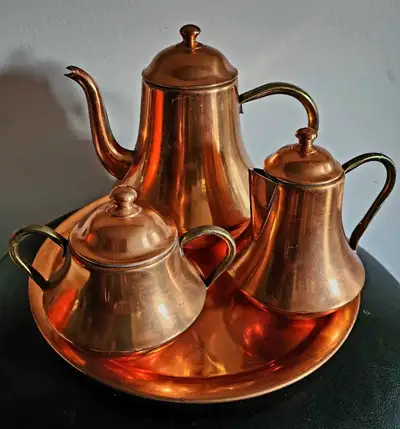 This lovely, vintage copper tea set is made in Portugal and includes a tea pot, sugar bowl, creamer...