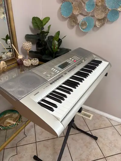 PIANO KEYBOARD WITH LIGHTED KEYS IN GREAT CONDITION & STAND, View more