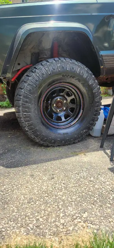 These Goodyear Wrangler tires mounted on 15x8 inch black steel rims are ready for your next off-road...