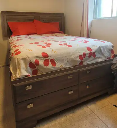 This is a used double bed frame with a drawer base, offering both style and functionality. The frame...