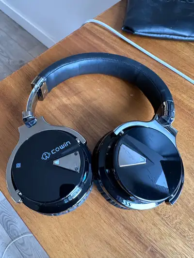 Lightly used headphones Still work well Includes bag Cowin brand