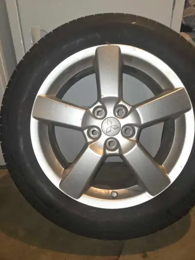 Selling a set of 4 Michelin 225/55R18 summer tires mounted on original Mitsubishi 18-inch alloy rims...