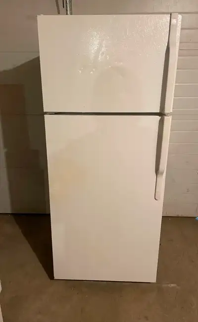 WHITE GARAGE FRIDGE $200. FRIDGE IS IN GOOD WORKING CONDITION AND FREE DELIVERY. FRIDGE IS 67 INCHES...