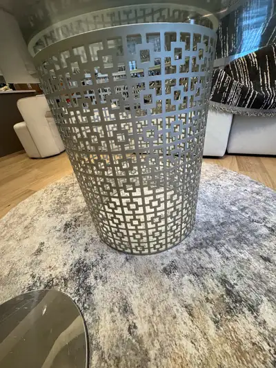 This mint 52-inch round glass dining table features a stylish metal base, perfect for adding a moder...