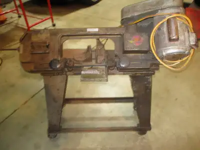 Horizontal and vertical band saw for metal or wood. Has stand with wheels $275 call 905 679 6808 day...
