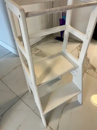 White wooden Learning Tower — perfect for toddlers who love to help in the kitchen! Sturdy and stabl...