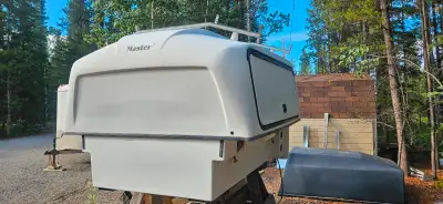 Short box mory canopy. Has a split roller deck and simple ladder rack. Lighting in side access compa...